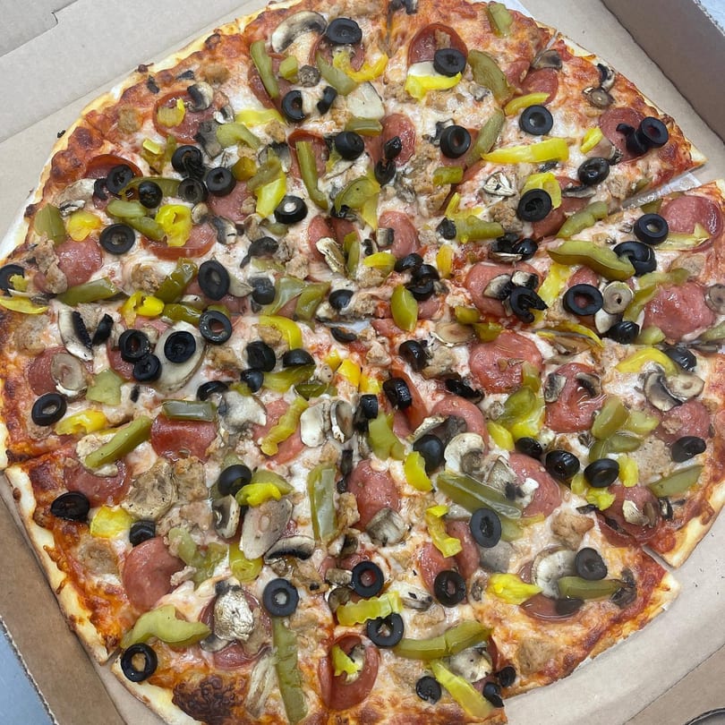 Jake's Pizza Rostraver's large pizza with pepperoni, sausage, mushrooms, olives, and peppers.